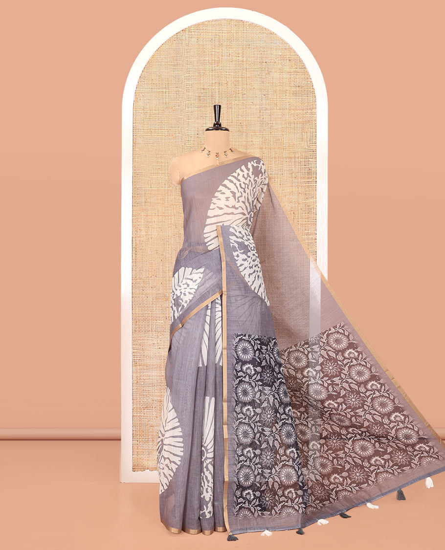 Grey Linen Cotton Saree, Mesmerized with Floral Motifs Printed on Its Body, Subtle Piping Border, Complemented by a Contrast Floral Printed Blouse, and Paired with a Contrast Blouse