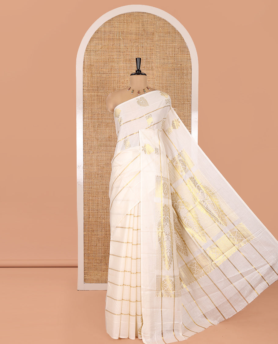 Cream Kerala Cotton Saree, Delicately Woven with Zari Stripes and Buttas, Highlighted by an Intricate Pallu and a Matching Blouse