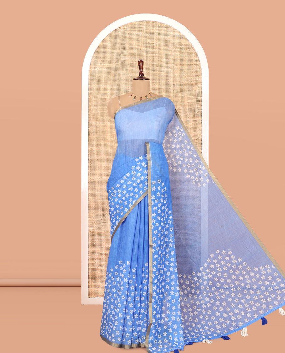 Blue Linen Cotton Saree Features Half-And-Half-Style Flower Motifs Print, a Piping Border, and a Matching Blouse