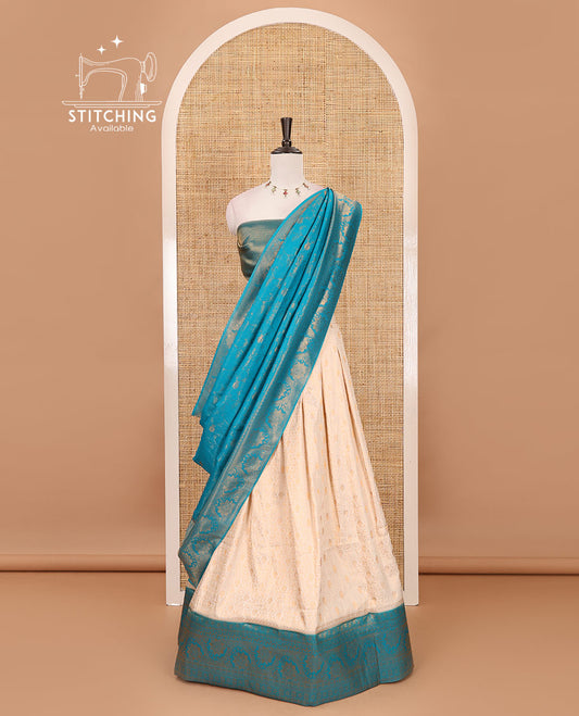 Cream-rama green half-saree, zari jacquard & contrast traditional zari border banaras softy skirt, semi-banaras jacquard blouse & contrast zari design blouse
