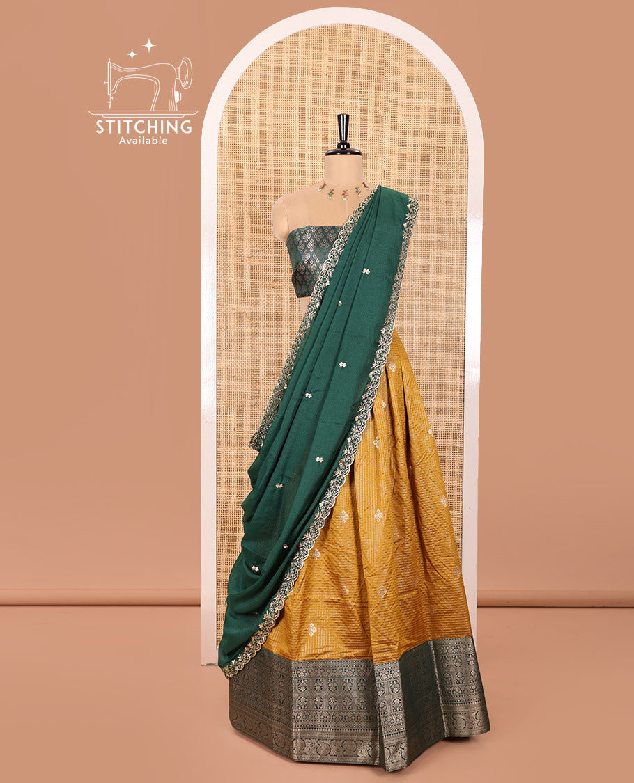 Yellow and Green Banaras Silk Half-Saree Featuring Zari Checks and Zari Buttas All Over the Skirt, Complemented by Contrast Traditional Zari Design Border, Paired with a Jacquard Blouse, and a Rangoli Georgette Dhavani of Embroidery and Scallop Border