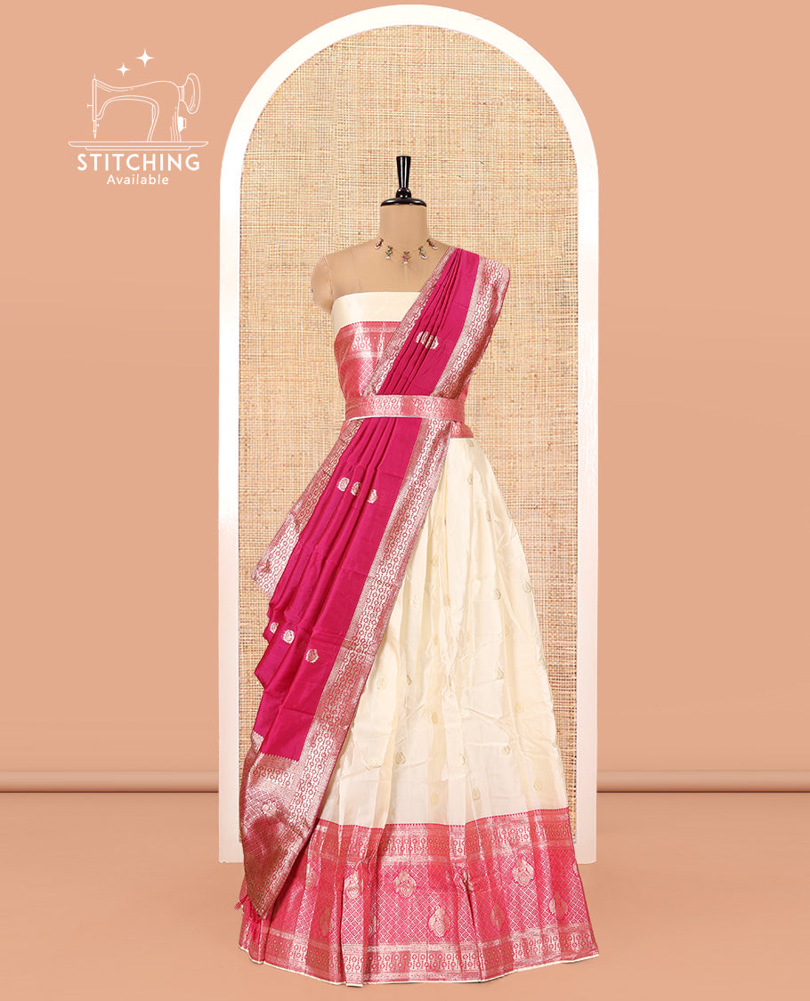 Cream-Rani Pink Semi-Banarasi Half-Saree Set Featuring Buttas Skirt, Contrast Traditional Border, a Matching Blouse, and a Banaras Dhavani