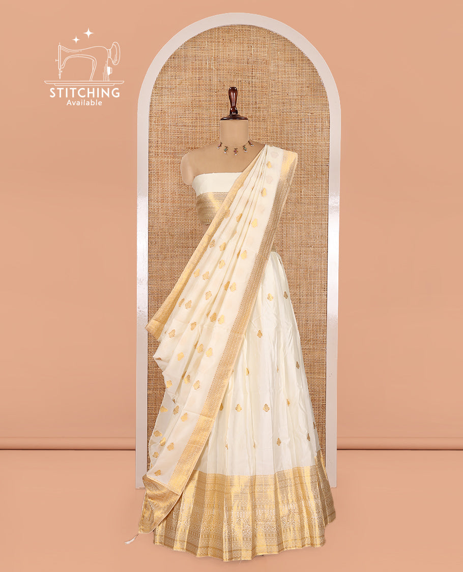 Cream Banarasi Silk Half-Saree Features Zari Buttas Skirt, a Traditional Border, Matching Blouse, and Zari-Woven Dhavani