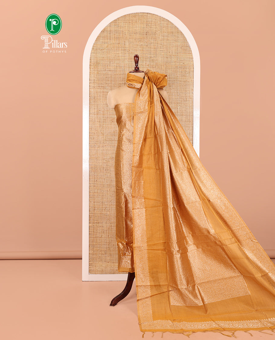 Mustard Banarasi Material Chudidar Features Jacquard Top, a Matching Santoon Bottom, and an Intricately Designed Dupatta