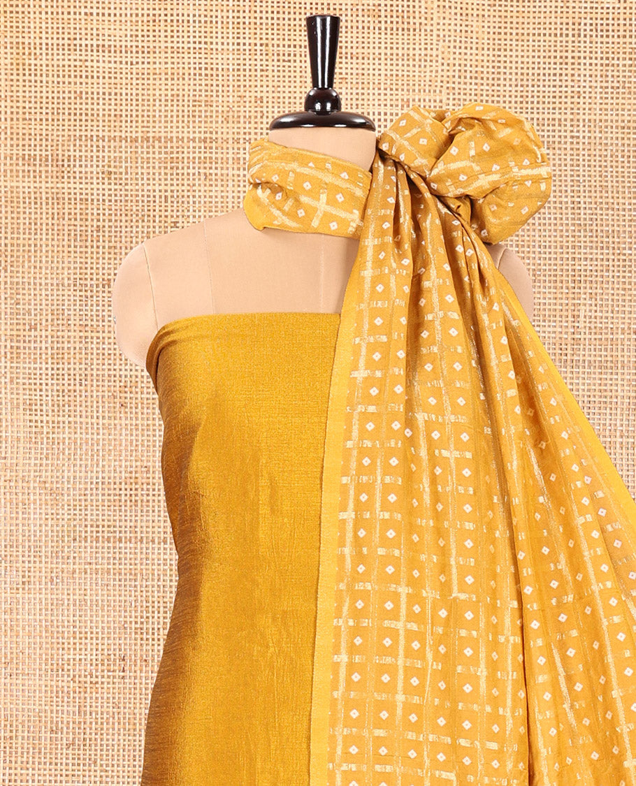 Mustard Vichitra Silk Material Churidar Set, Subtly Made Plain Top, a Plain Santoon Bottom, and Paired with a Vichitra Silk Bandhani Dot Enclosed Checked Dupatta