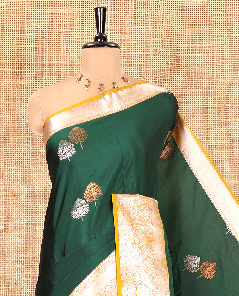 Bottle Green Semi-Soft Silk Saree, Detailed with Zari Buttas All Over Its Body, Complemented by a Contrast Traditional Zari Design Border, Intricately Designed Pallu, and Paired with a Contrast Blouse