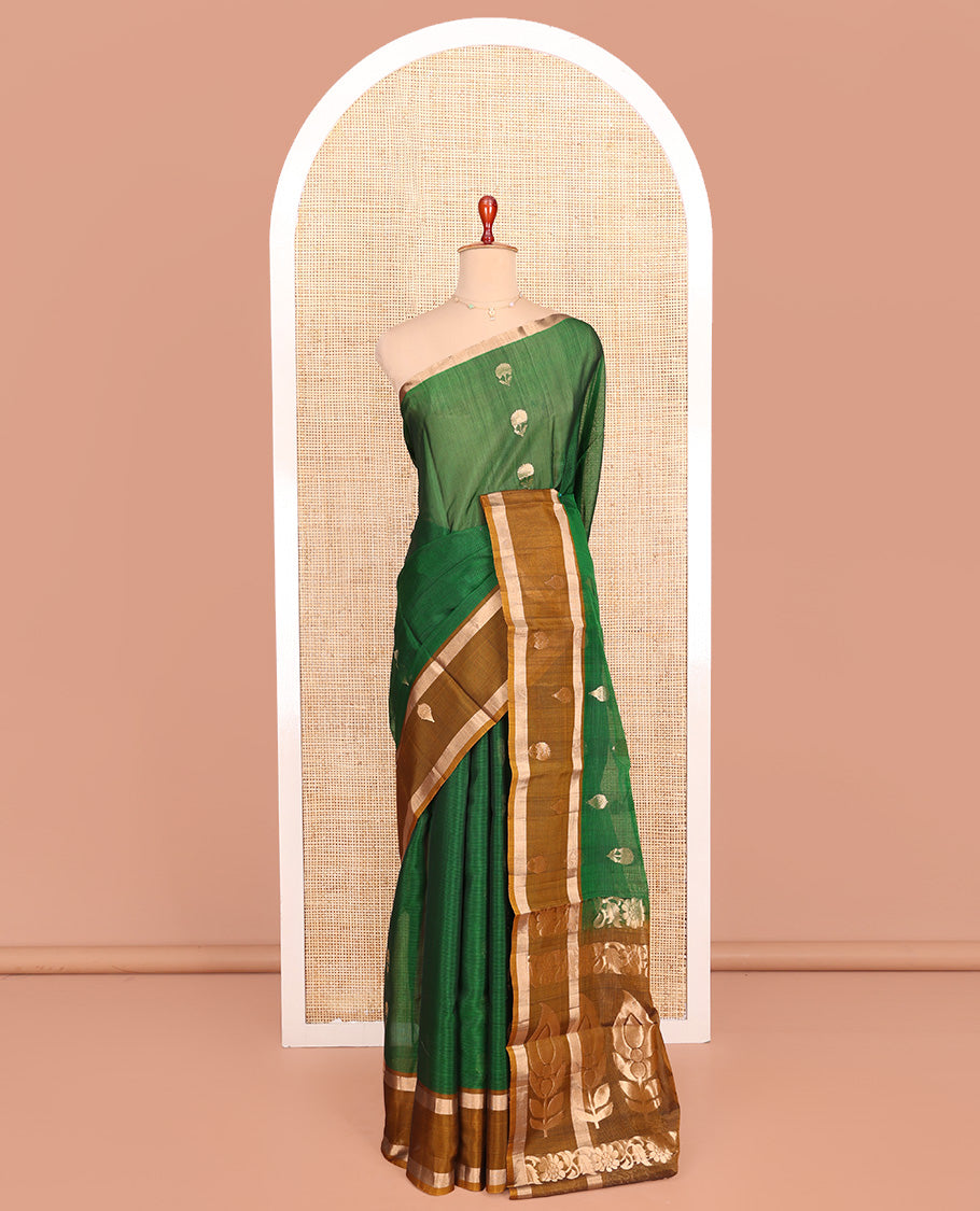 Green Silk Cotton Saree, Spotlighted with Floral Zari Buttas All Over Its Body, Complemented by a Contrast Zari Design Border, Pallu Features Floral and Paisley Designs, and Paired with a Contrast Blouse
