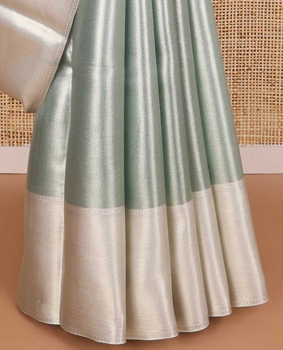 light blue chevron design tissue saree with contrast striped border & zari design pallu