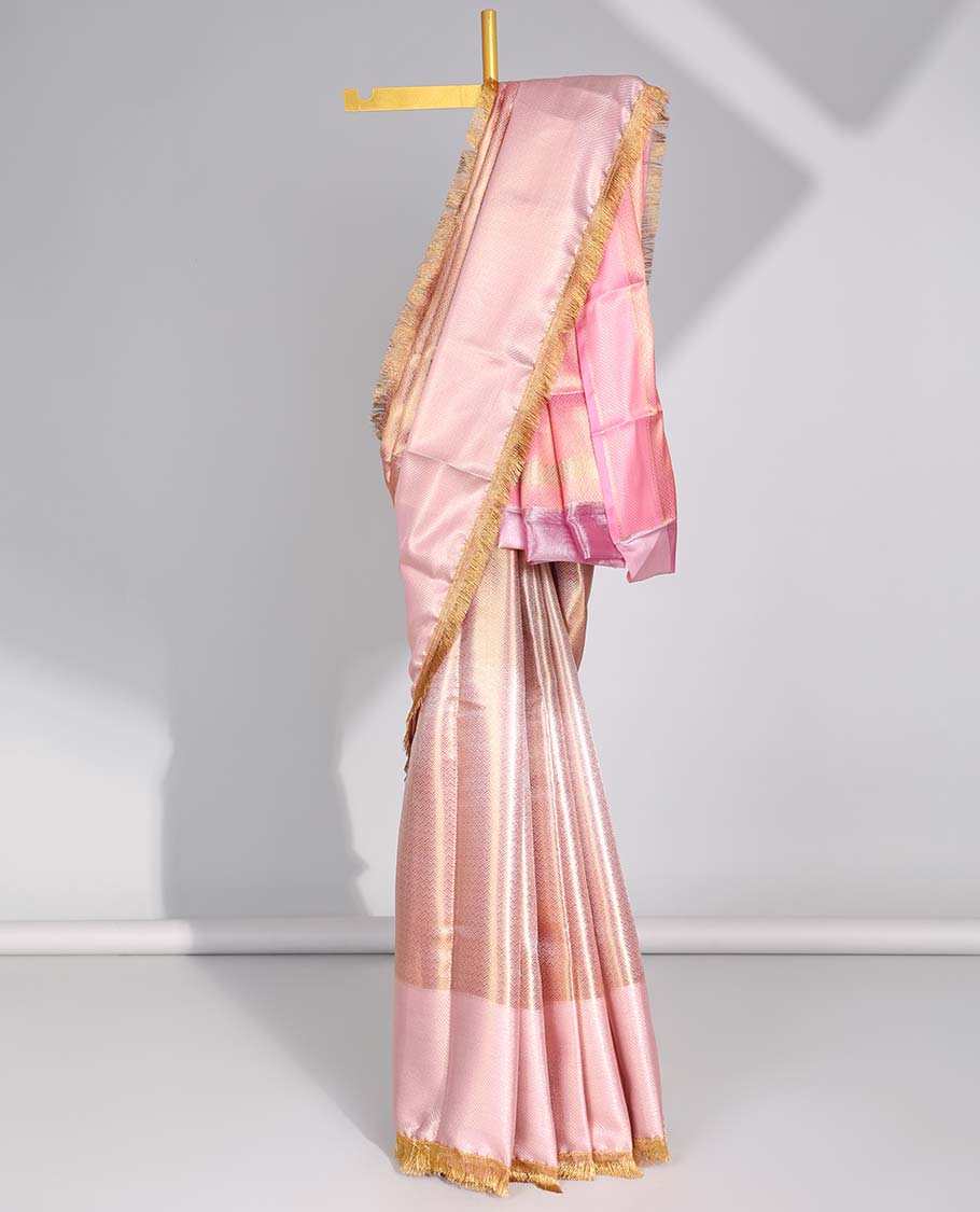 Pastel pink zig zag striped tissue saree with self striped border & intricate zari design pallu