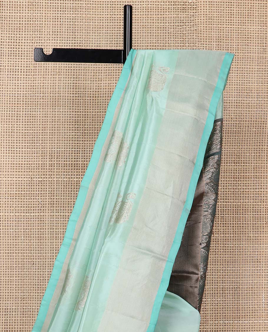 Light blue motifs uppada silk saree with self zari border & floral design pallu
