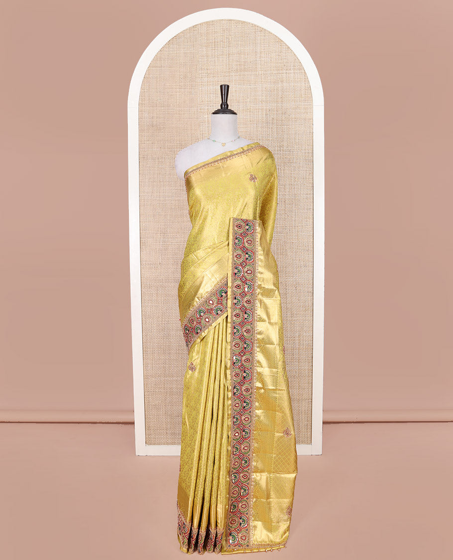 Yellow Vastrakala Silk Saree, Artfully Detailed with Floral Jacquard and Patch Work, Complemented by Mixed Intricately Embroidered Border, Grand Jaal Design Stone Work Pallu, and Paired with Heavy Embroidered Blouse