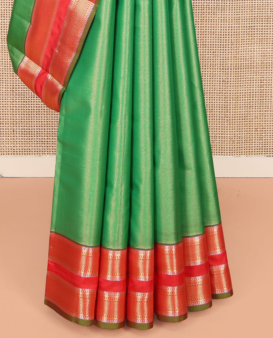 Green Vasundhara Lite Silk Mix Saree, Delicately Woven with Zari Stripes on Its Body, Complemented by a Contrast Rettai Pettu Border of Ara Bogudi, Paisa, Banaras, and Ara Maadam Designs, a Grand Pallu, and Paired with a Contrast Blouse