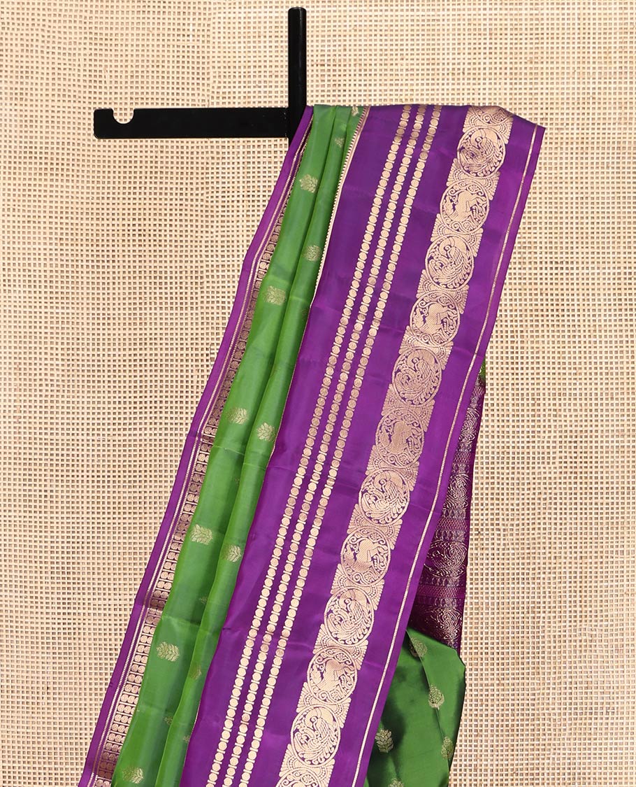 Green Vasundhara Lite-Silk Mix Saree Featuring Zari Buttas, a Contrast Rekku Border of Rudraksham, Round Mayil, and Round Yaali Designs, Grand Pallu, and a Contrast Blouse