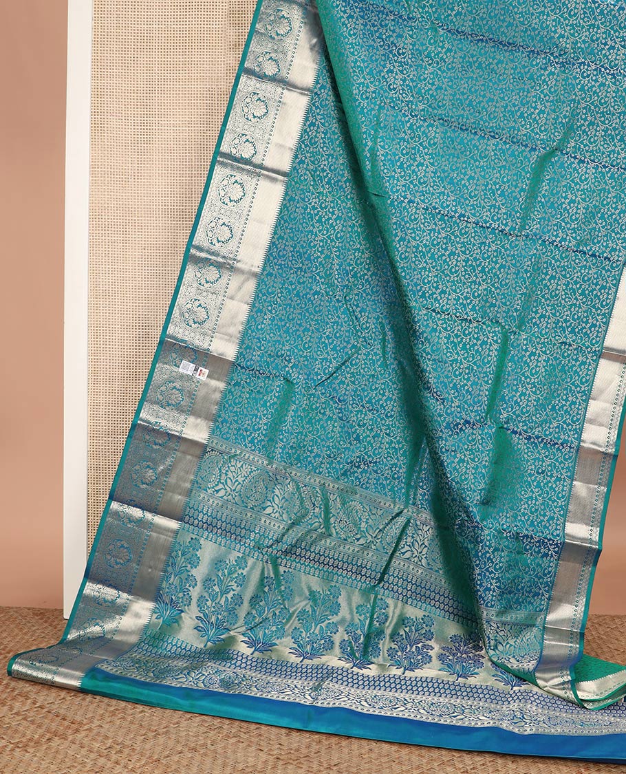 Blue jacquard Kanchipuram wedding silk saree, zari border of rekku, kuyil kann, thilakam mokku, Muthu, and floral design, and floral design pallu