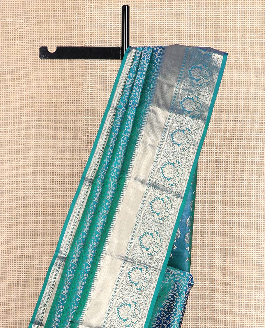 Blue jacquard Kanchipuram wedding silk saree, zari border of rekku, kuyil kann, thilakam mokku, Muthu, and floral design, and floral design pallu