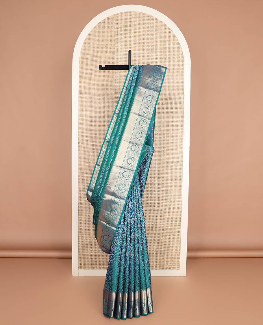 Blue jacquard Kanchipuram wedding silk saree, zari border of rekku, kuyil kann, thilakam mokku, Muthu, and floral design, and floral design pallu