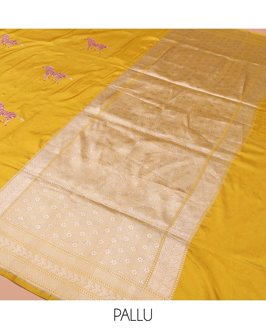 Yellow Banarasi Silk Saree Elevated with Zebra Motifs All Over Its Body, a Subtle Border of Traditional Designs, Pallu Decked Up with Floral and Diamond Designs, and Paired with a Matching Blouse