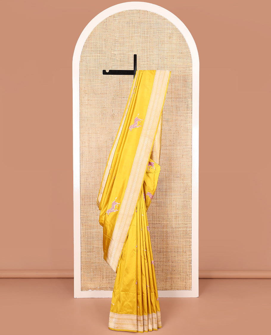 Yellow Banarasi Silk Saree Elevated with Zebra Motifs All Over Its Body, a Subtle Border of Traditional Designs, Pallu Decked Up with Floral and Diamond Designs, and Paired with a Matching Blouse
