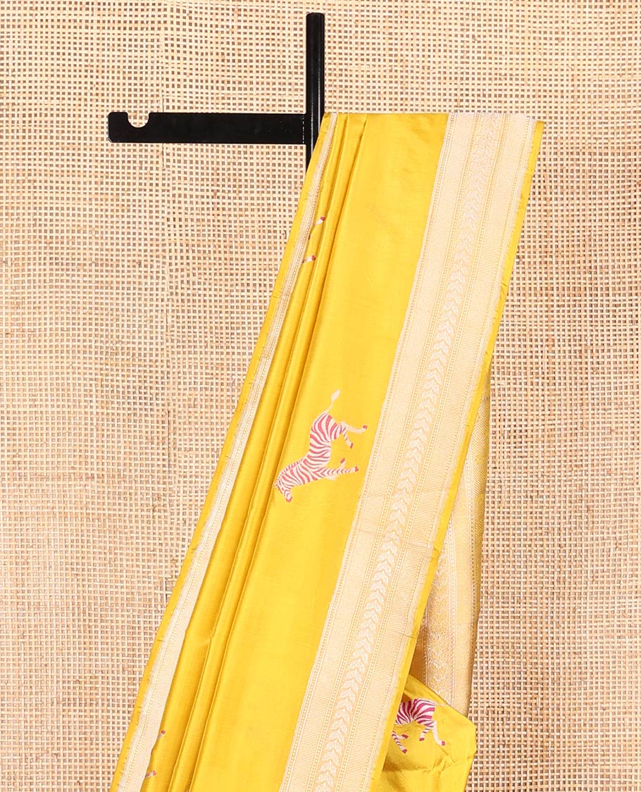 Yellow Banarasi Silk Saree Elevated with Zebra Motifs All Over Its Body, a Subtle Border of Traditional Designs, Pallu Decked Up with Floral and Diamond Designs, and Paired with a Matching Blouse