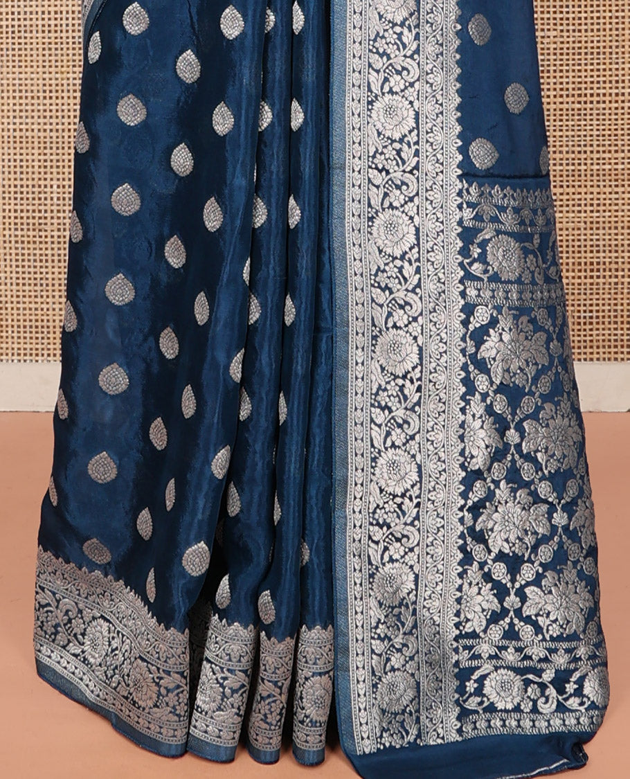 Blue Fancy Crepe Saree, Gleamed Up with Thilakam Buttas, Highlighted by a Traditional Border, Intricately Designed Pallu, and a Matching Blouse