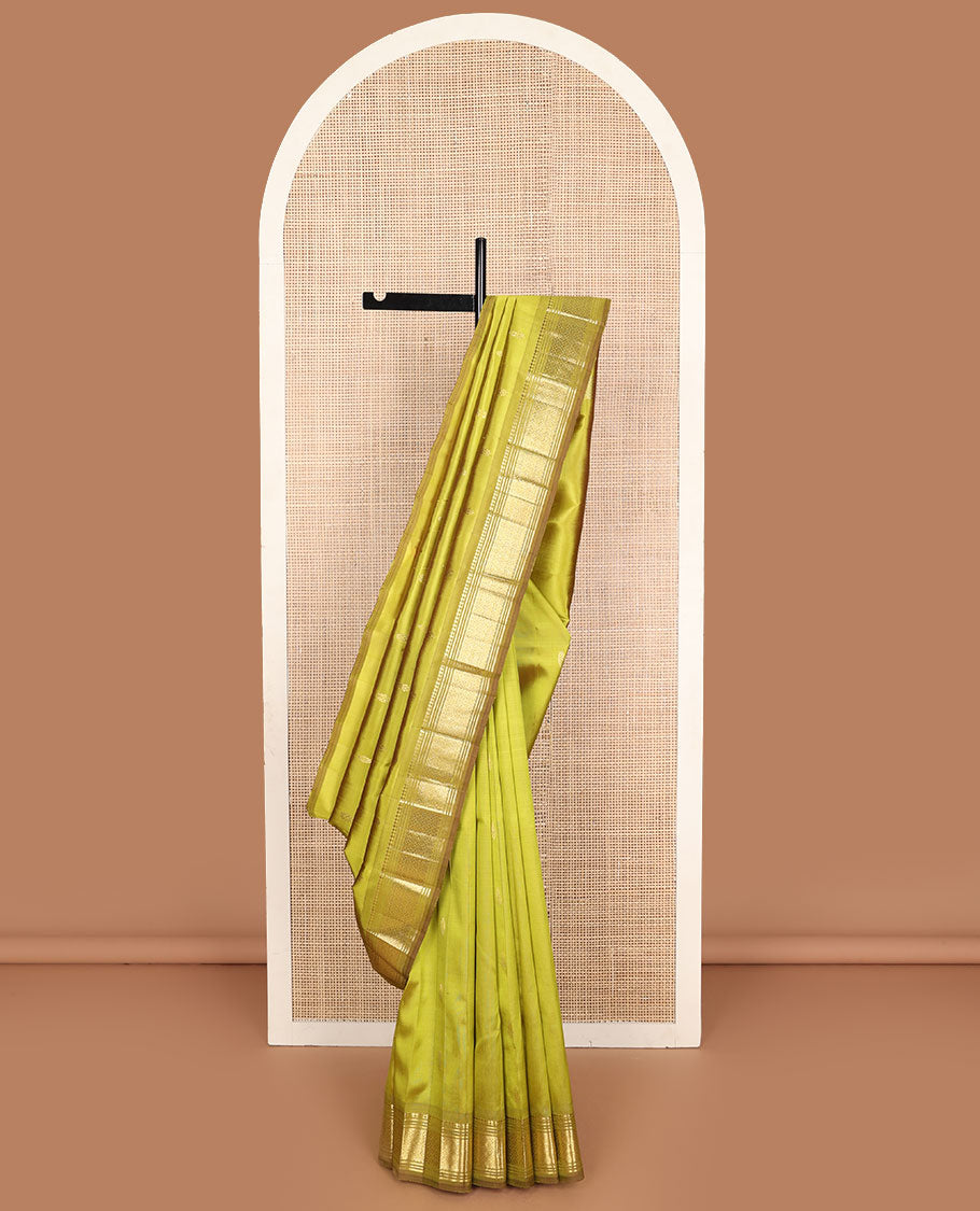 Green zari buttas Kanchipuram silk saree, one-sided zari border of paneer sombu, banaras, muthu, and jaal designs, and zari design pallu
