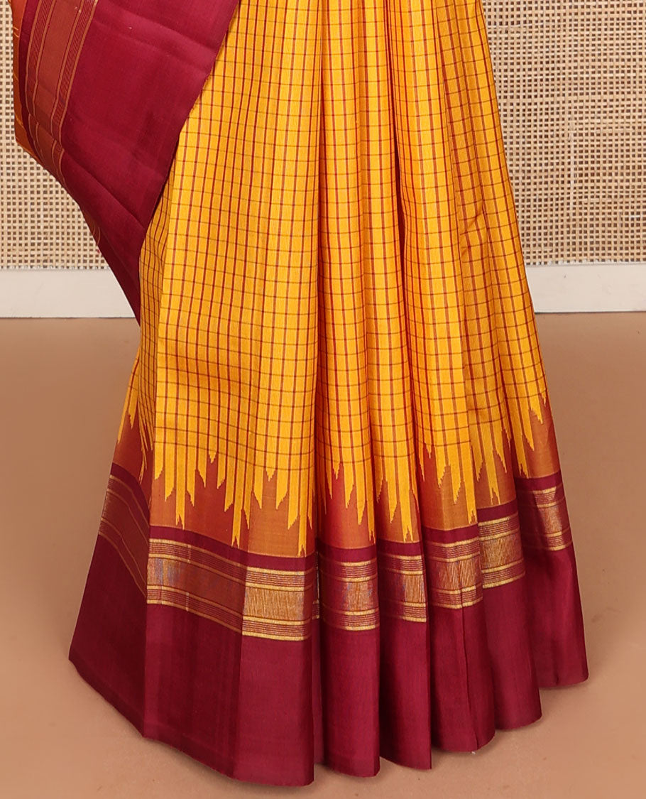 Yellow micro-checked kanchipuram silk saree, contrast thazampoo rekku striped border & pallu of stripes & pillaiyar mokku designs