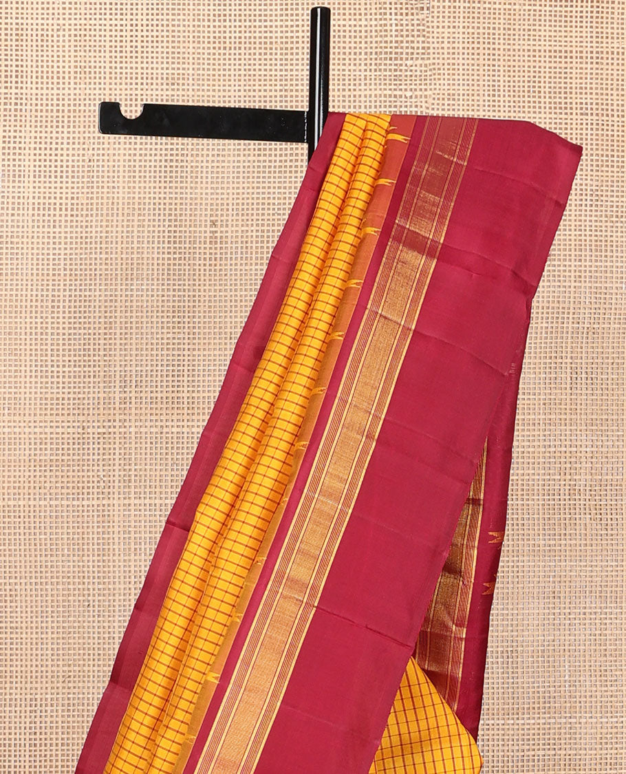 Yellow micro-checked kanchipuram silk saree, contrast thazampoo rekku striped border & pallu of stripes & pillaiyar mokku designs
