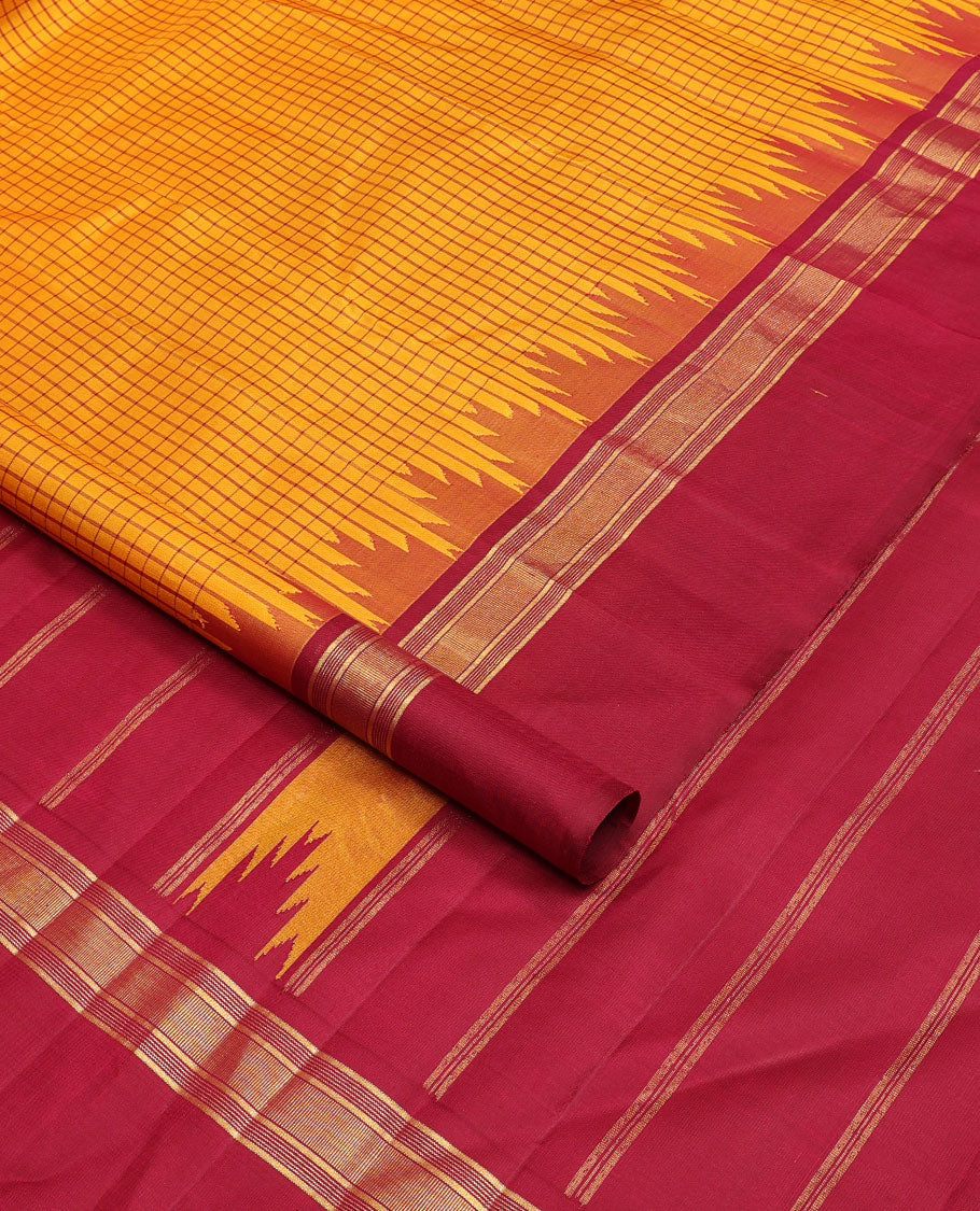 Yellow micro-checked kanchipuram silk saree, contrast thazampoo rekku striped border & pallu of stripes & pillaiyar mokku designs