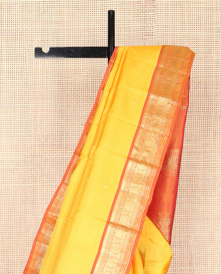Yellow vazhaipoo striped & zari buttas silk saree, contrast border of manga mokku,muthu,chakram, jada nagam & kili & zari design pallu