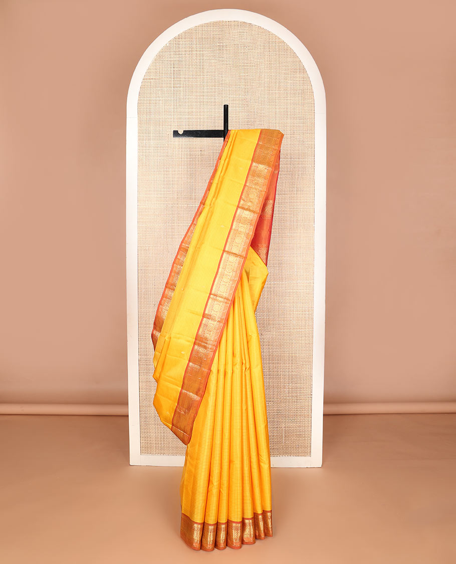 Yellow vazhaipoo striped & zari buttas silk saree, contrast border of manga mokku,muthu,chakram, jada nagam & kili & zari design pallu