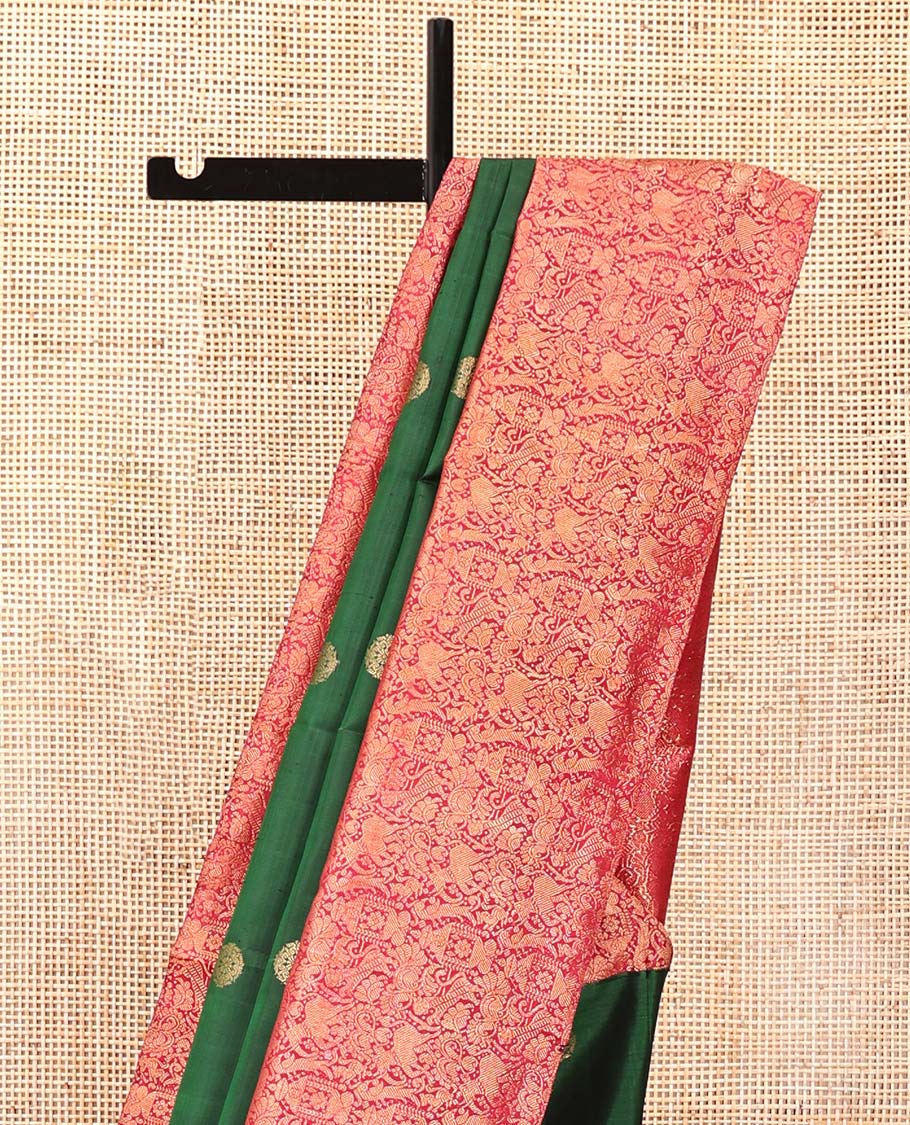 Green Kanchipuram Designer Silk Saree, Entralled with Chakram Buttas All Over Its Body, Complemented by Contrast Historically Woven Border of Yaali and Yaanai Designs, Grand Jaal Pallu and Paired with a Contrast Blouse