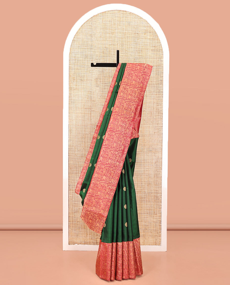 Green Kanchipuram Designer Silk Saree, Entralled with Chakram Buttas All Over Its Body, Complemented by Contrast Historically Woven Border of Yaali and Yaanai Designs, Grand Jaal Pallu and Paired with a Contrast Blouse