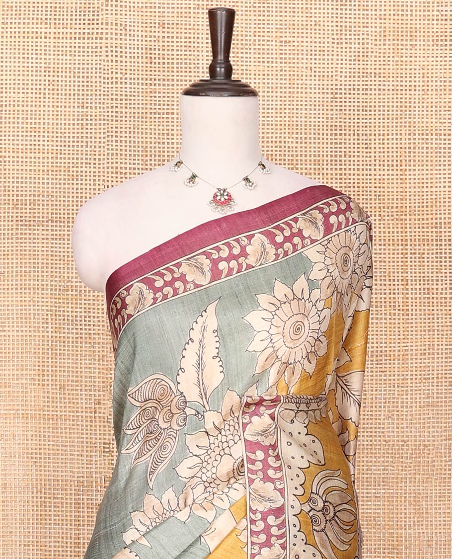 Grey Printed Silk Saree Decked Up with Floral and Ancient Human Motifs Print, Complemented with a Contrast Printed Border, Pallu Beautifully Printed with Lord Krishna and Radha Figurines, and Paired with a Contrast Printed Blouse