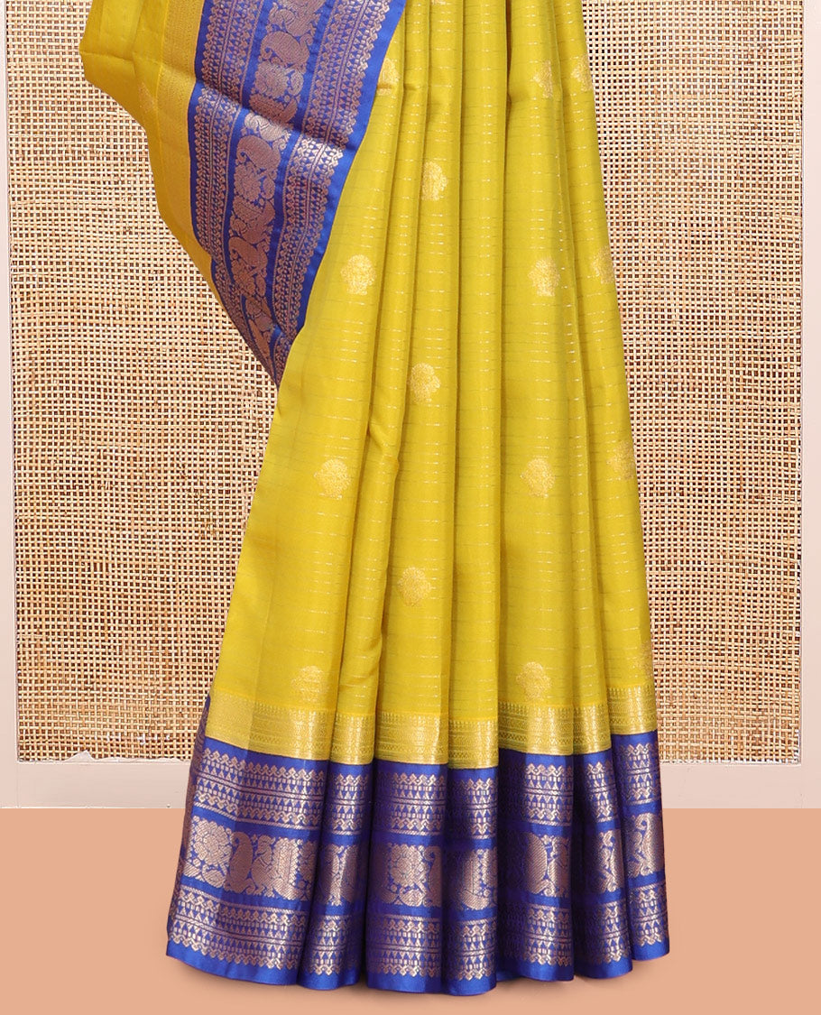 Green Vasundhara Lite Silk Mix Saree, Beautified with Zari Buttas and Checks, a Contrast Border of Kathir, Neli, Rekku, Thilakam Mokku, Manga, and Mayil Designs, Grand Pallu, and a Contrast Blouse