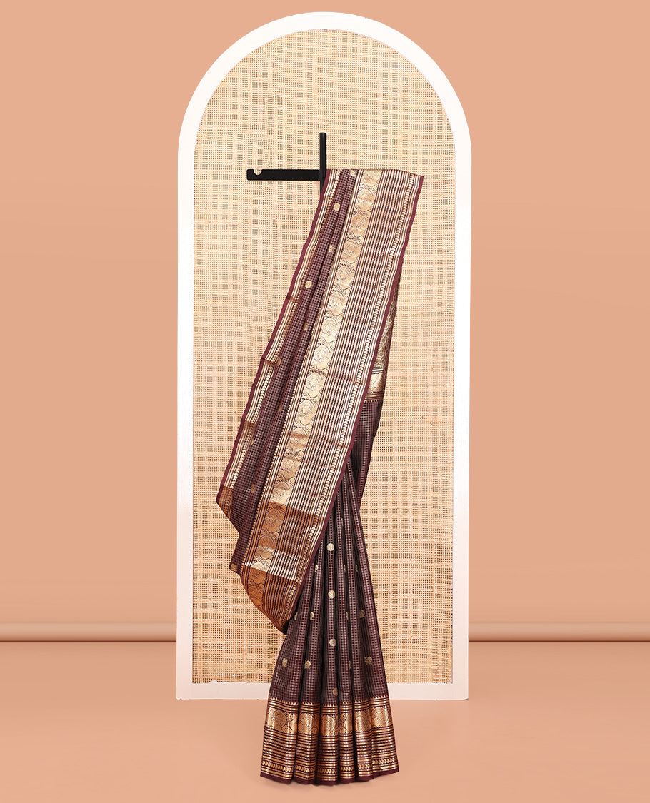 Brown Vasundhara Silk Saree, Masterfully Woven with Zari Buttas and Checks All Over Its Body, Highlighted by Zari Border of Rekku, Muthu, Kathir, Mayil, Neli, and Manga Designs, Grand Pallu, and Paired with a Contrast Blouse