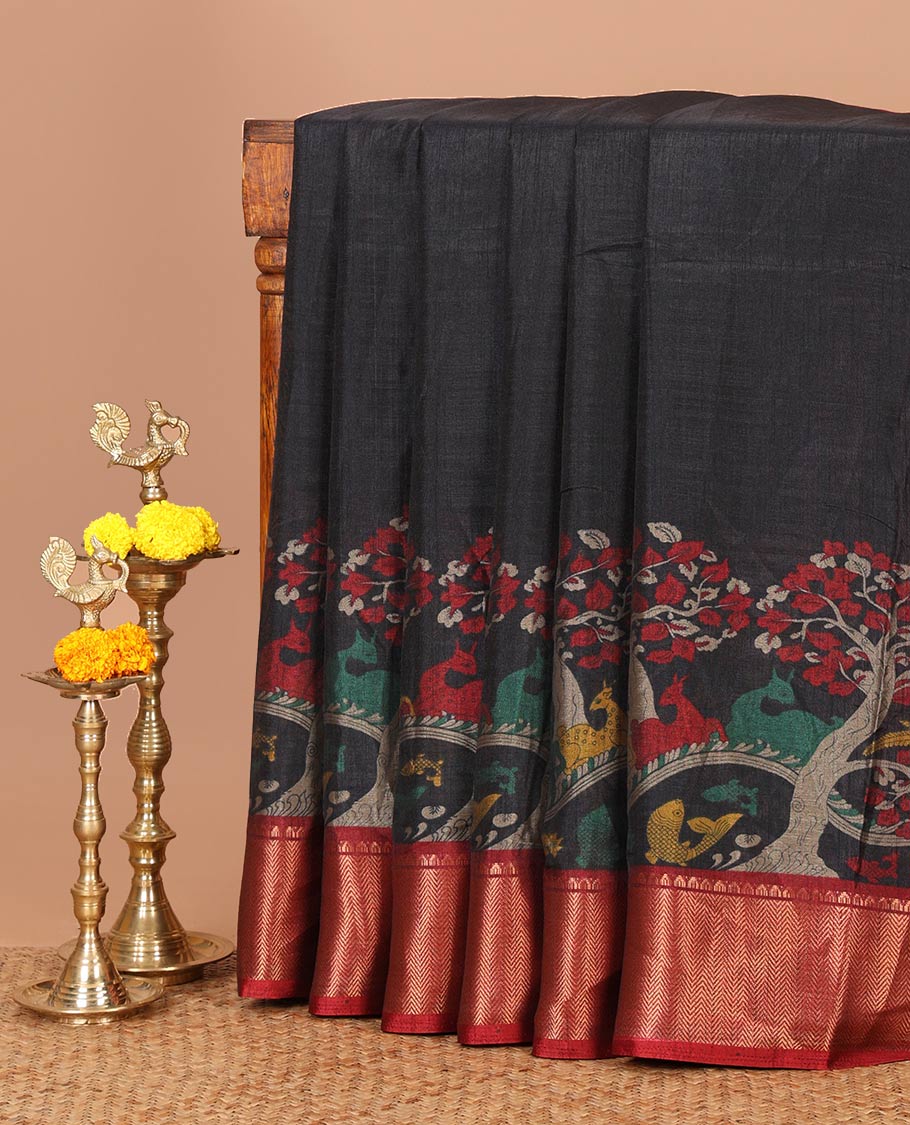Black skirt-style kalamkari printed dola silksaree, contrast copper zari border,flora-fauna print pallu & zari border blouse