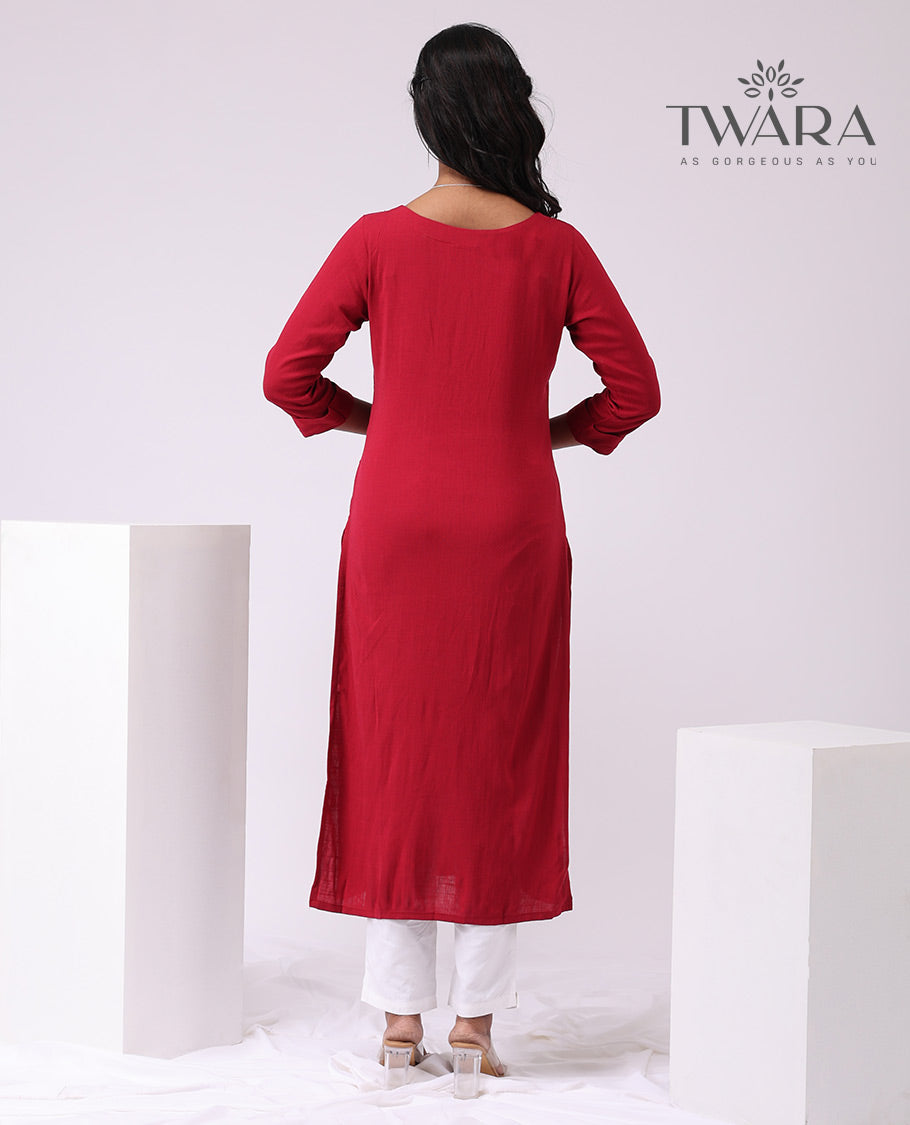 Twara red intricate embroidered round neck , 3/4 th sleeve , below knee leght straight cut kurti