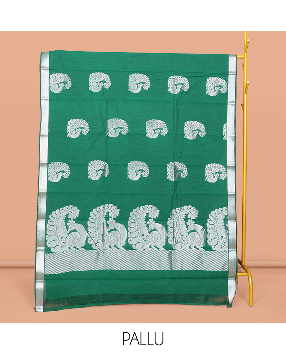 Green Semi-Silk Cotton Saree, Mesmerized with Peacock Buttas All Over Its Body, Highlighted by a Zari Border, Pallu Artfully Woven with Peacock Designs, and Paired with a Matching Blouse