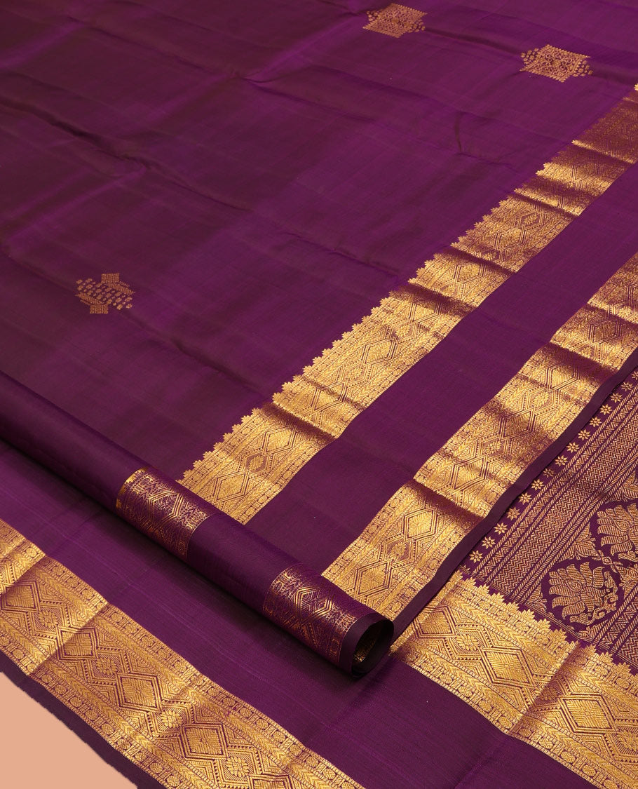 Purple Kanchipuram Silk Saree, Accentuated with Zari Buttas, Highlighted by Zari Rettai Pettu Border of Thazampoo Rekku, Muthu, Poun, and Diamond Designs, Manga Pallu, and Matching Blouse
