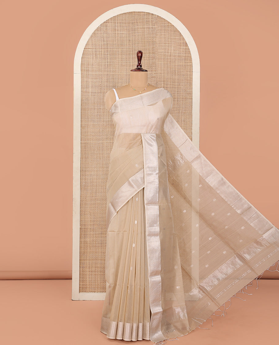 Beige Maheshwari Cotton Saree, Detailed with Flower Buttas All Over Its Body, Highlighted by Traditional Zari Design Border, Pallu Steeped with Flower Buttas, and Paired with a Matching Blouse