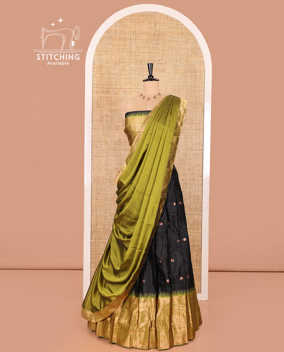 Black and Green Semi-Banaras Half-Saree Featuring Zari Buttas All Over the Skirt, Accentuated with a Contrast Traditional Zari Design Border, Paired with a Matching Blouse, and Has a Plain Syska Georgette Dhavani with a 4-Sided Zari Border