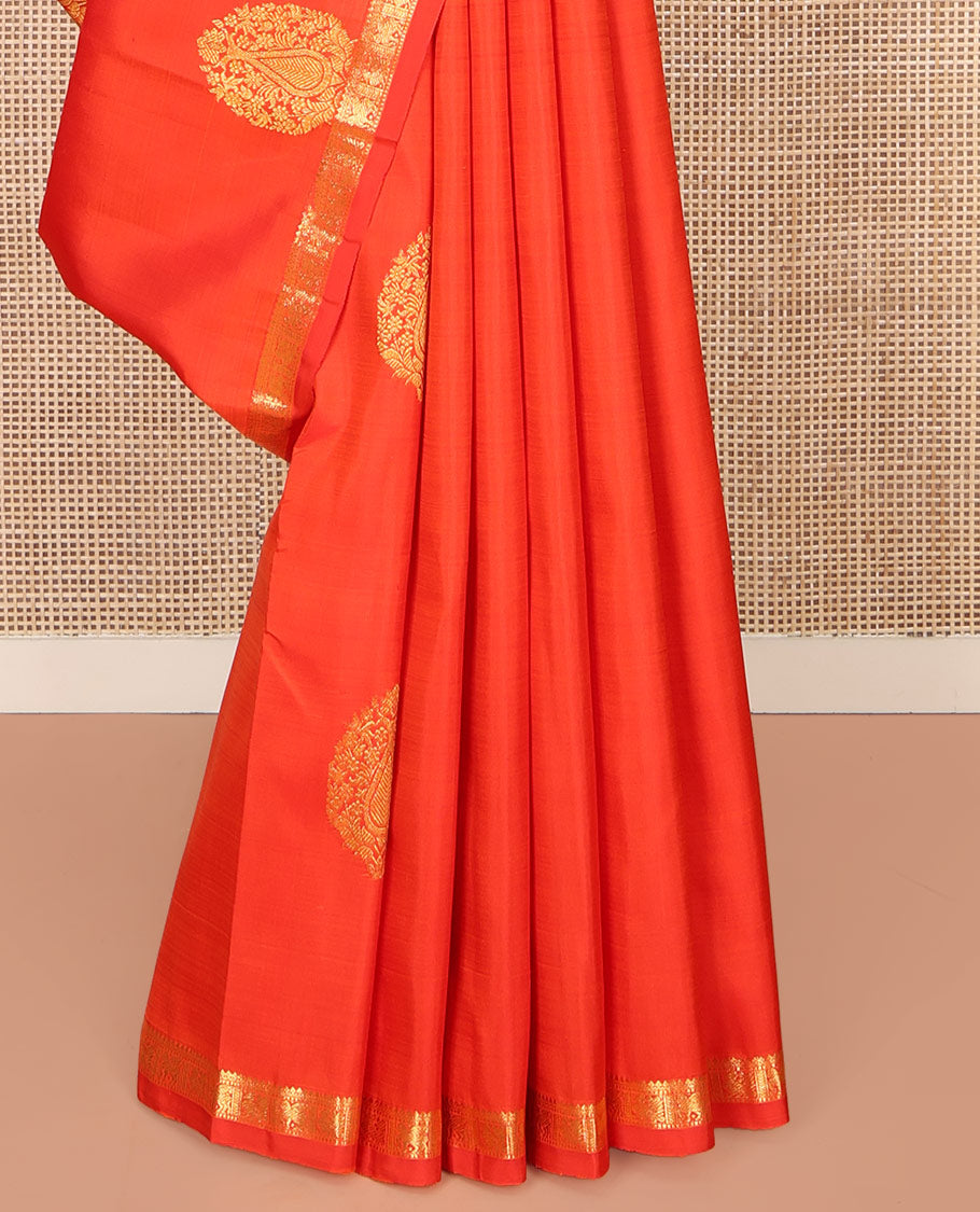 Orange Kanchipuram Silk Saree, Beautified with Zari Buttas All Over Its Body, Subtle Zari Piping Border, Complemented by a Contrast Pallu of Traditional Zari Designs, and Paired with a Contrast Blouse