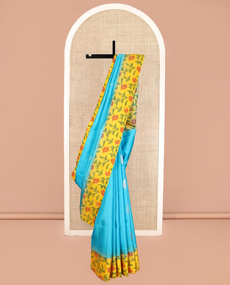 Blue Mayuri Soft Silk Saree, Elevated with Zari Buttas, Contrast Ikat Floral Border, and a Pallu Features Paisleys and a Contrast Blouse