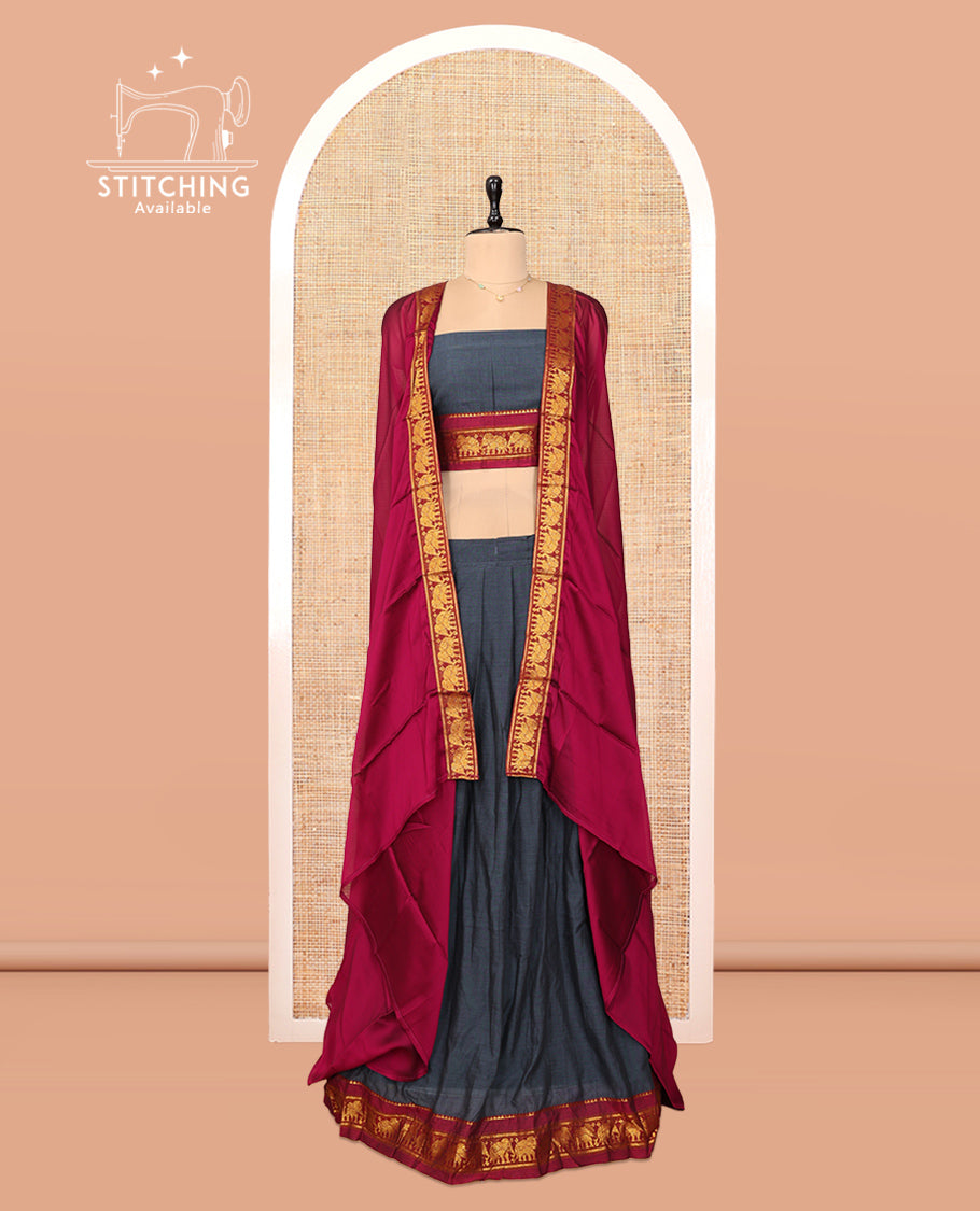 Grey Cotton Half-Saree Features Plain Skirt, a Contrast Elephant Border, a Matching Blouse, and a Contrast Dhavani