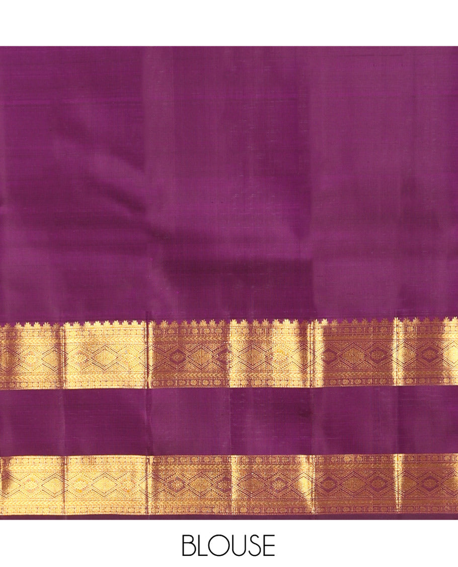 Purple Kanchipuram Silk Saree, Accentuated with Zari Buttas, Highlighted by Zari Rettai Pettu Border of Thazampoo Rekku, Muthu, Poun, and Diamond Designs, Manga Pallu, and Matching Blouse