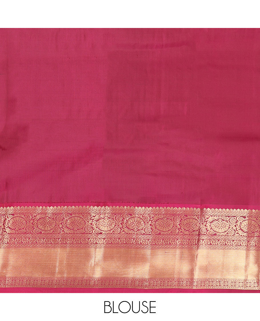 Blue Vasundhara Silk Saree, Impeccably Styled with Zari Buttas and Zari Stripes All Over Its Body, Complemented by a Contrast Border of Salngai, Puli Nagam, and Kodi Visiry Designs, Grand Gleaming Zari Woven Pallu, and Paired with a Contrast Blouse