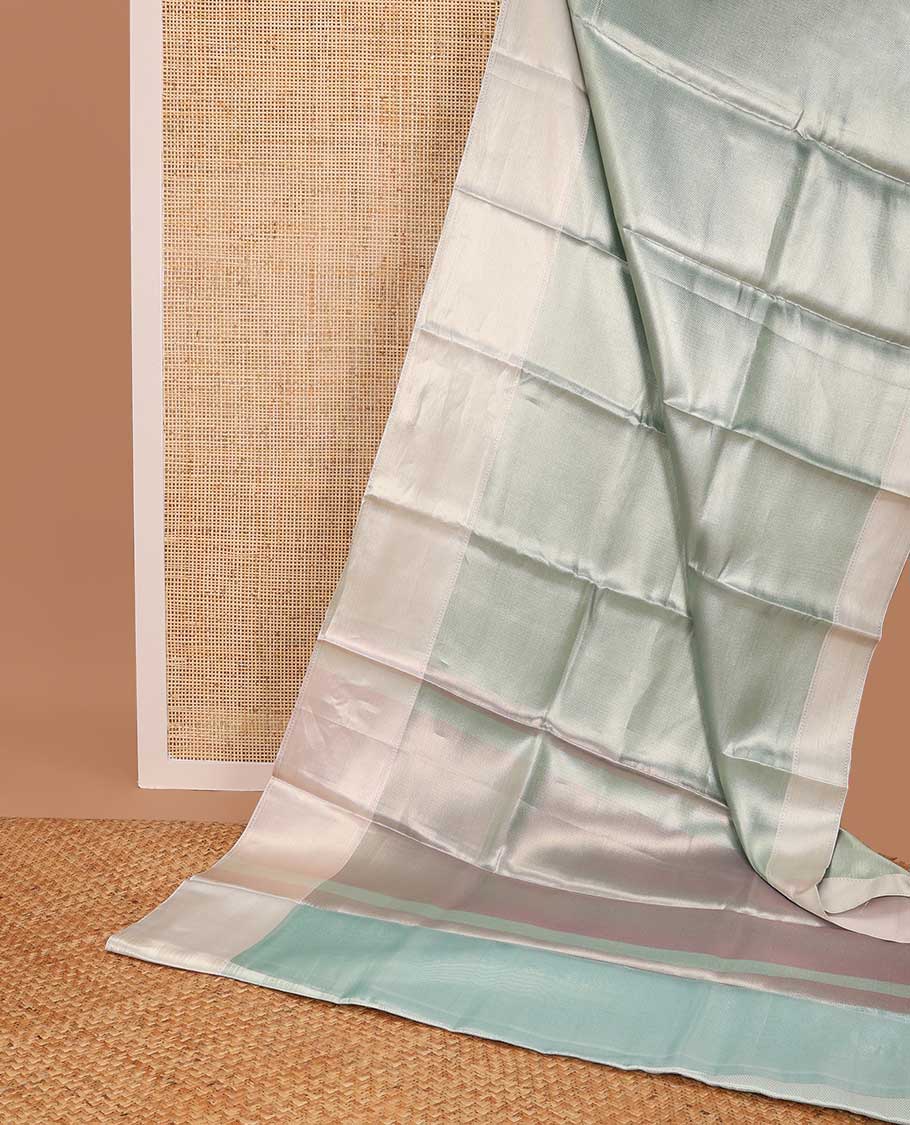 light blue chevron design tissue saree with contrast striped border & zari design pallu