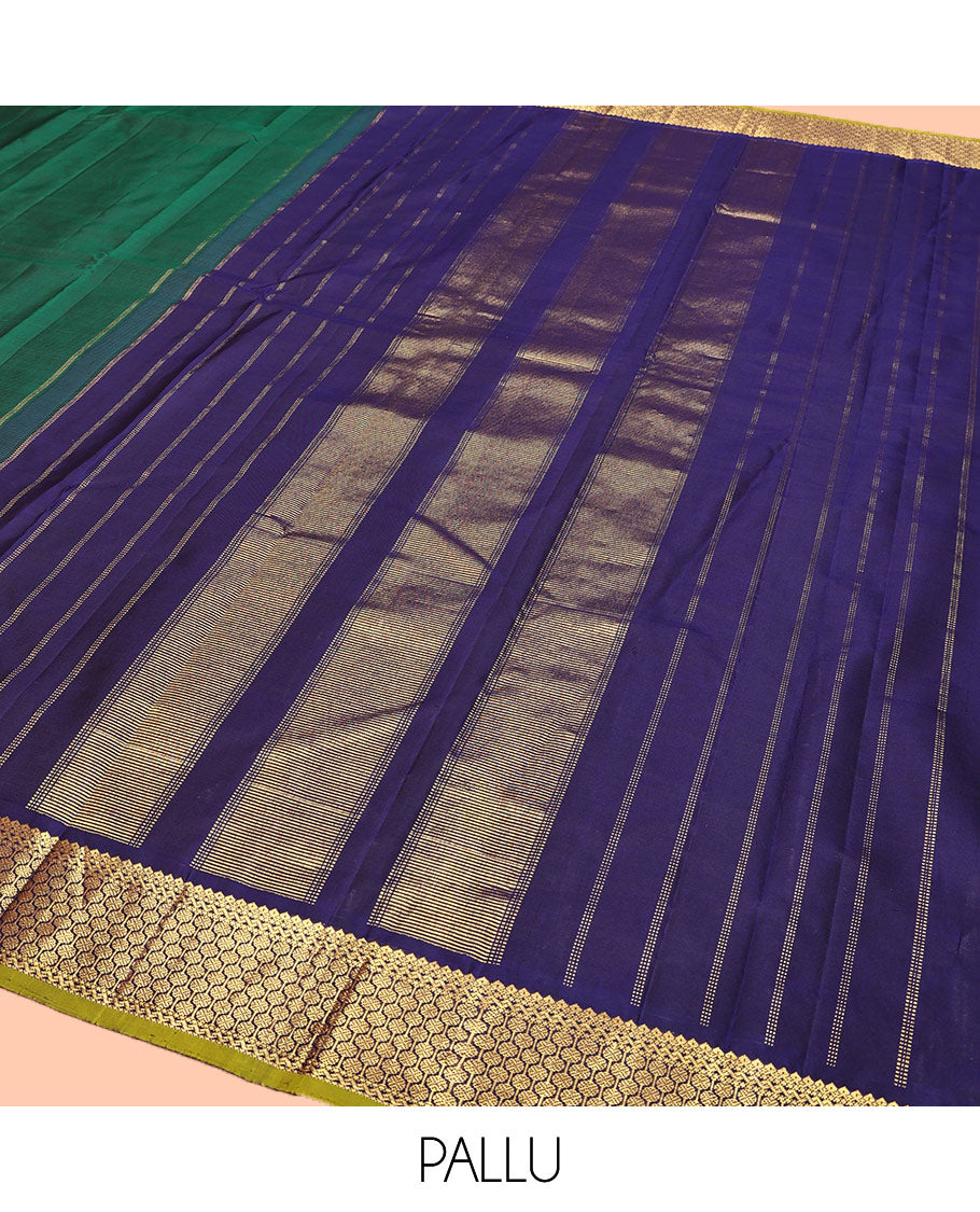 Green Plain Kanchipuram Silk Saree, Complemented by Contrast Border of Thilakam Mokku, and Rudraksham Designs, Pallu of Zari Designs, and Paired with a Contrast Blouse