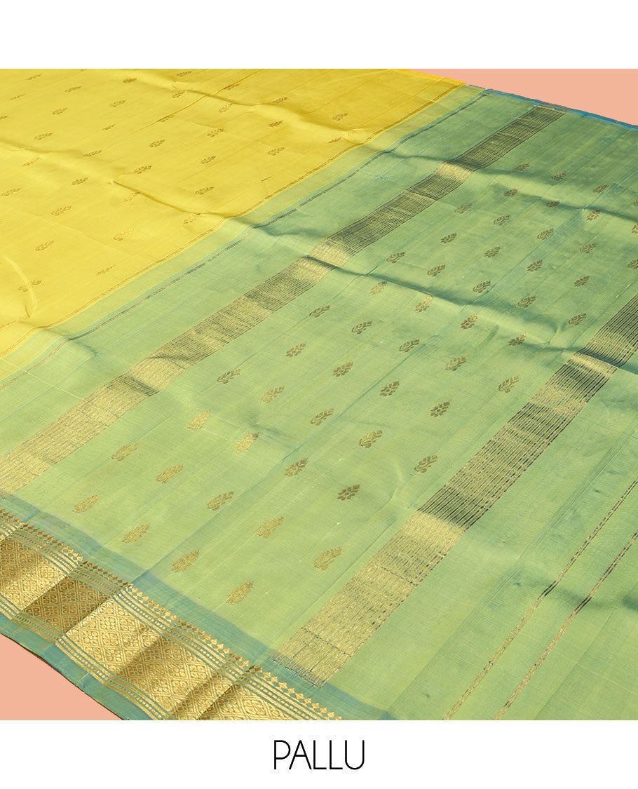 Yellow Kanchipuram Silk Saree, Sparsely Sparkled with Zari Buttas, a Contrast One-Sided Border of Panner Sombu, Banaras, Muthu, and Jaal Designs, a Zari Design Pallu, and No Blouse