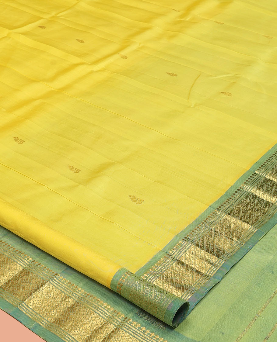 Yellow Kanchipuram Silk Saree, Sparsely Sparkled with Zari Buttas, a Contrast One-Sided Border of Panner Sombu, Banaras, Muthu, and Jaal Designs, a Zari Design Pallu, and No Blouse